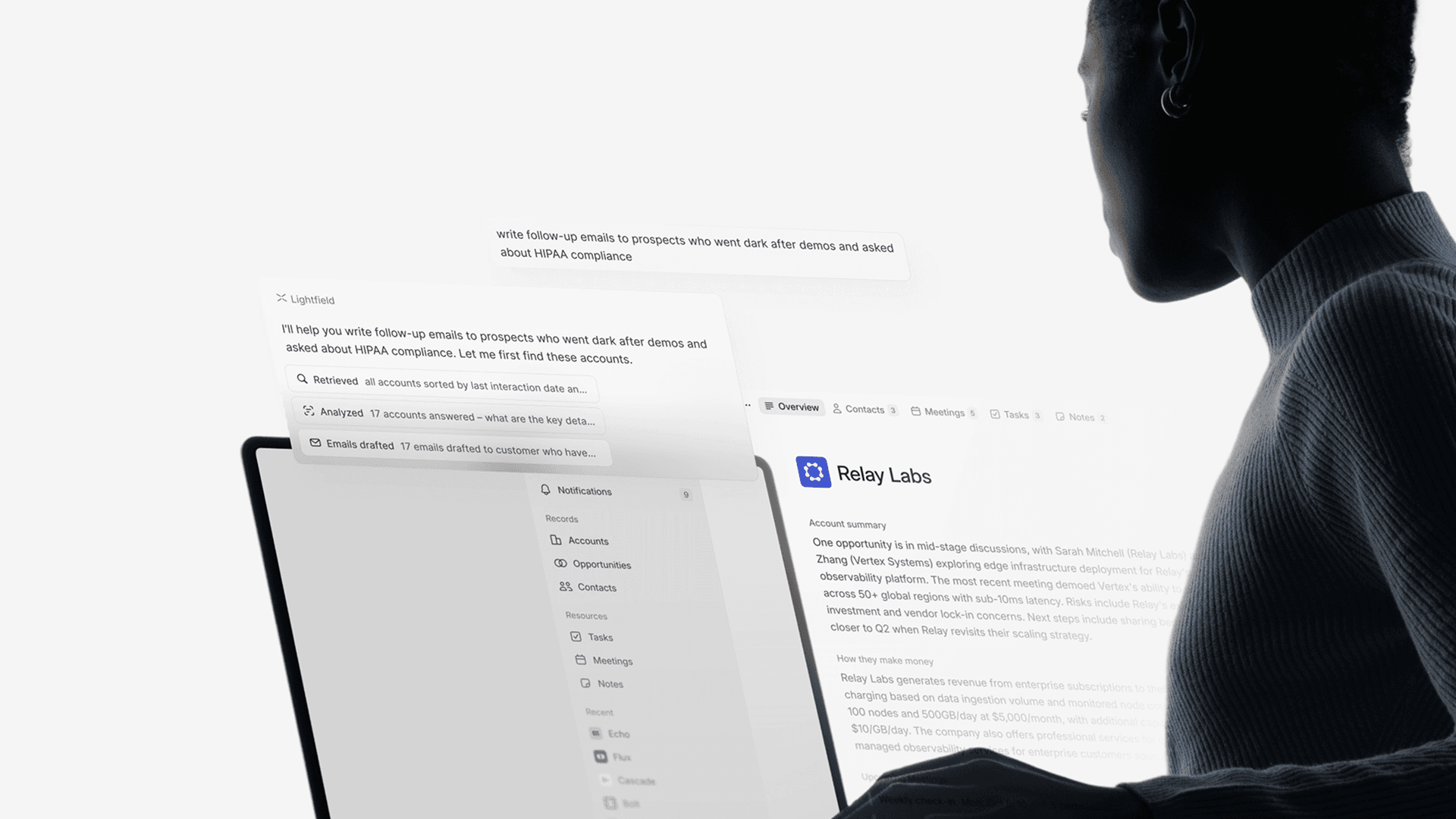 A person at a laptop working with Enorta's AI assistant, which is drafting follow-up emails inside a CRM account view.